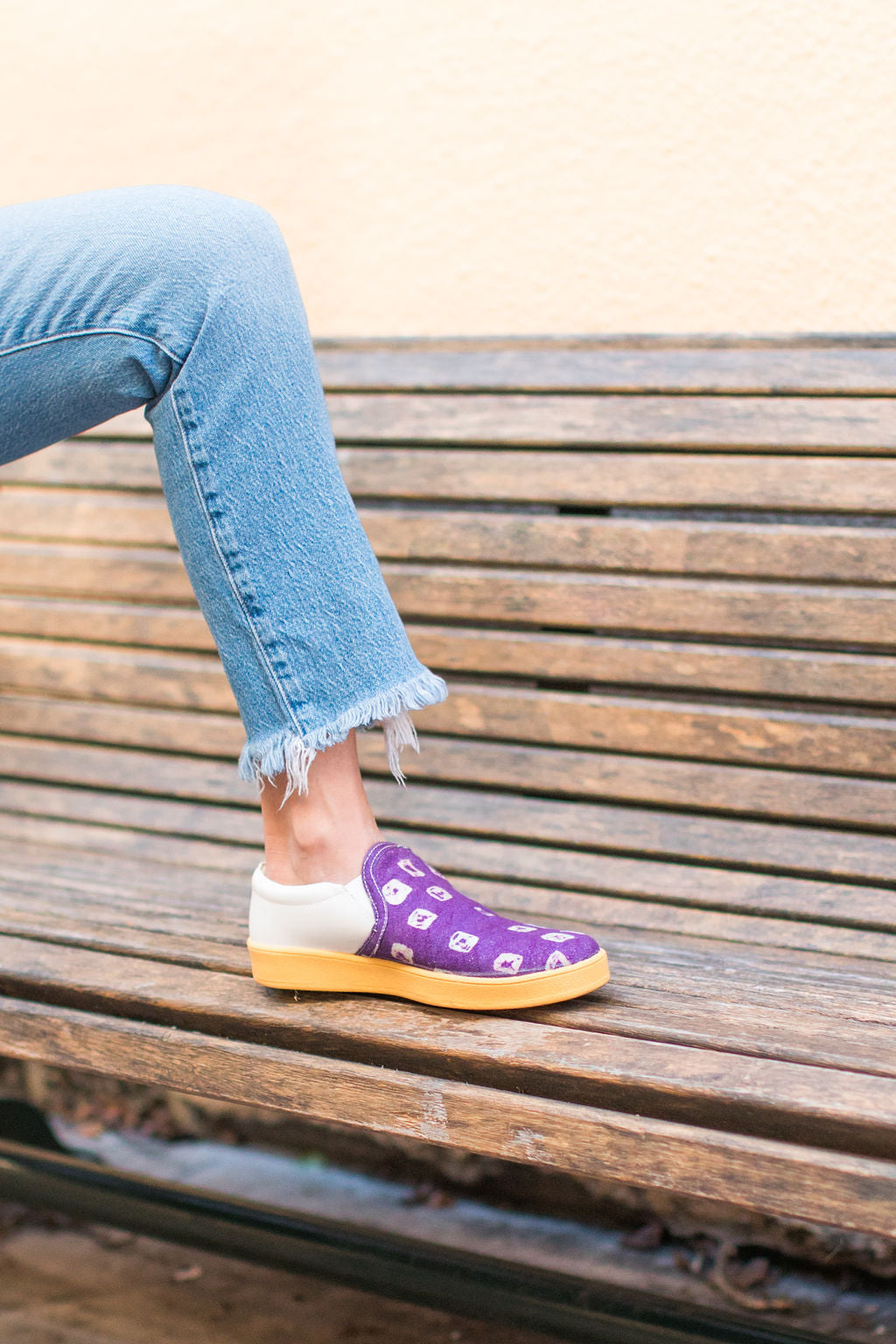 Tara shoe being worn by female on bench