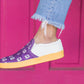 Tara shoe being worn by female in front of bright colored door